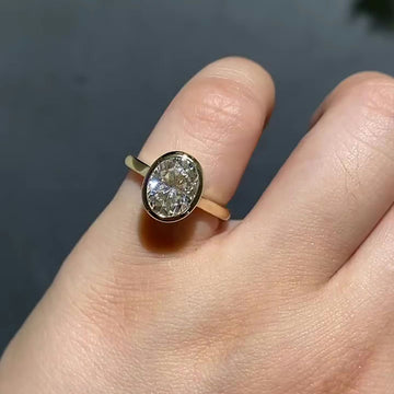 Modern Oval Lab Grown Diamond Engagement Ring with Bezel Setting