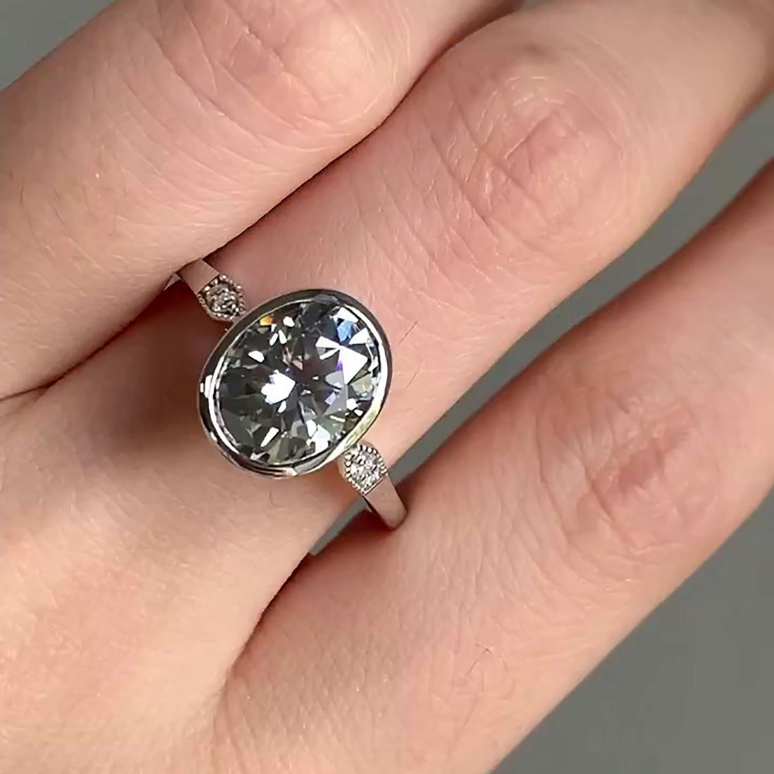 Modern Oval Lab Grown Diamond Engagement Ring with Bezel Setting