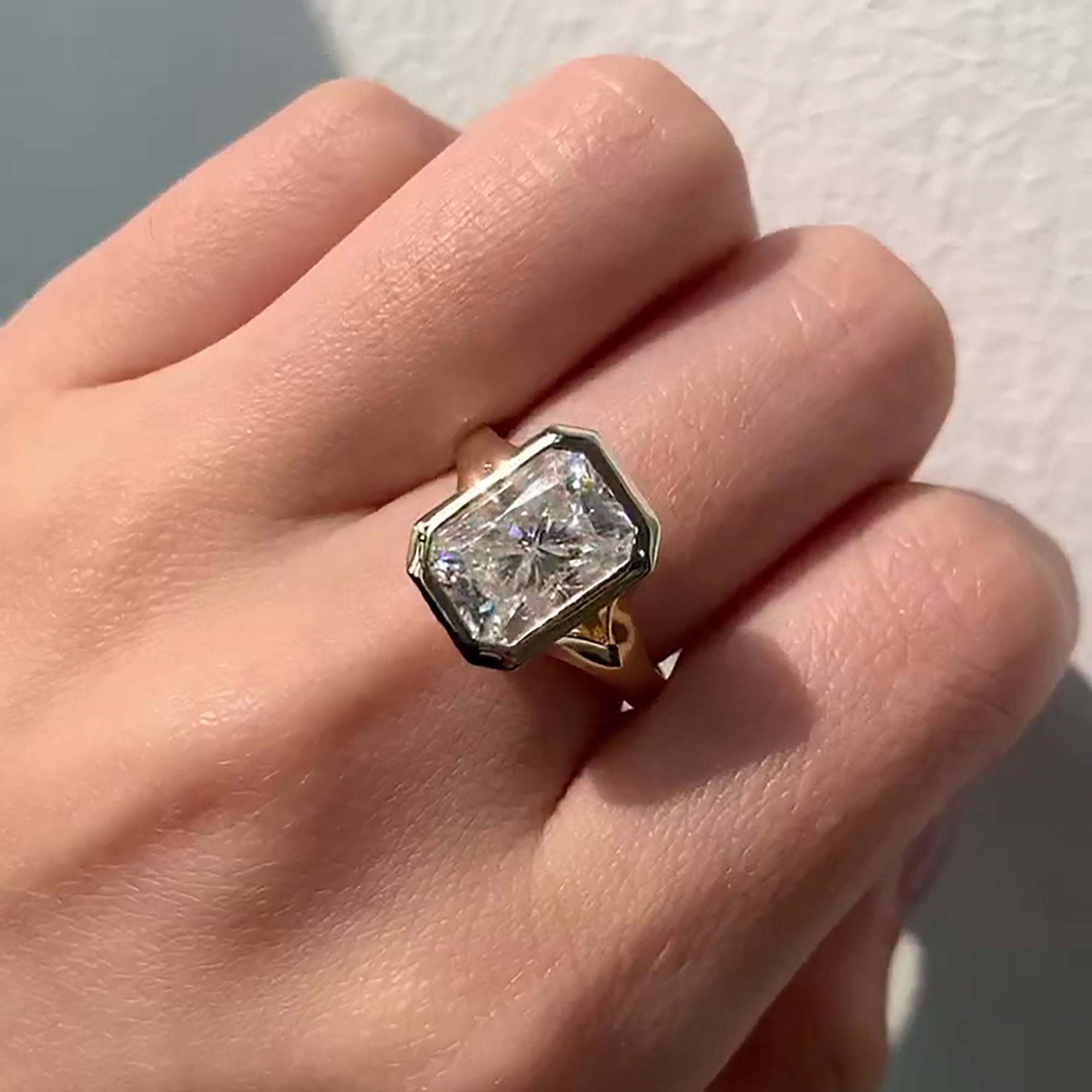 Radiant Cut Diamond Ring with Bezel Setting and High Profile